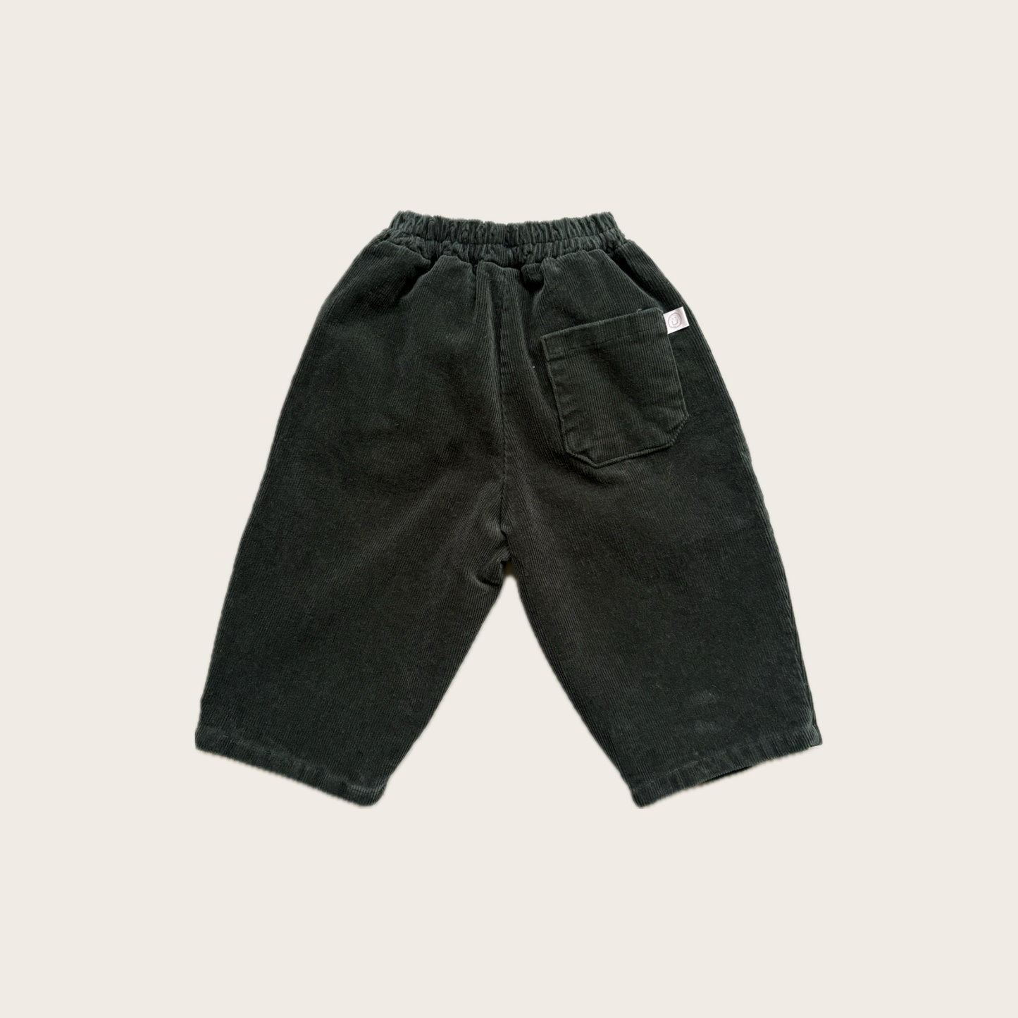 green corduroy trousers with single back pocket