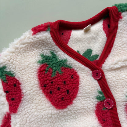 red and green strawberry print on soft fleece fabric