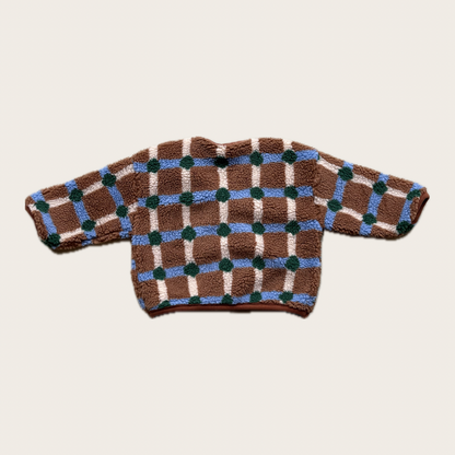 back of brown and blue check fleece jacket