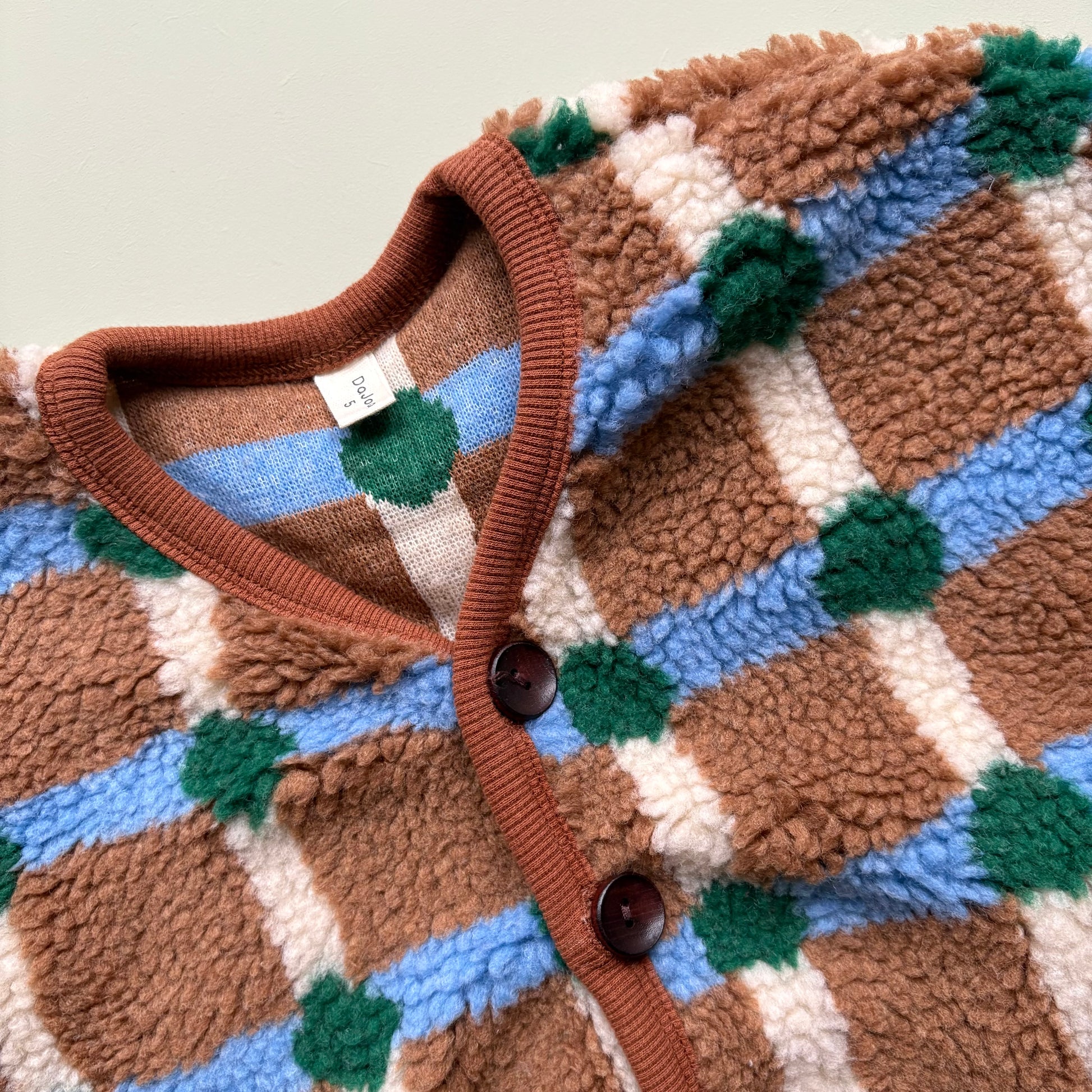 soft fleece texture in brown and blue check pattern
