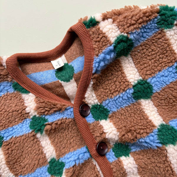 soft fleece texture in brown and blue check pattern