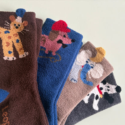 soft knit texture of cosy animal socks in brown blue and grey tones