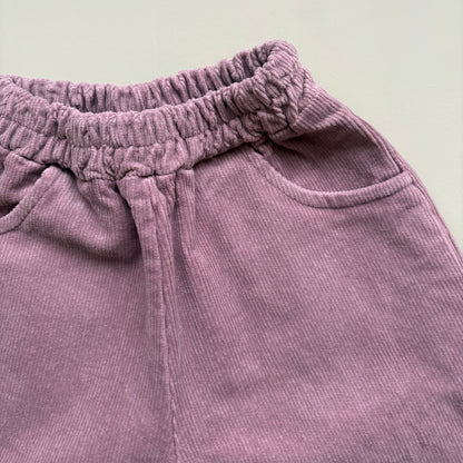 corduroy texture detail in lilac cotton trousers